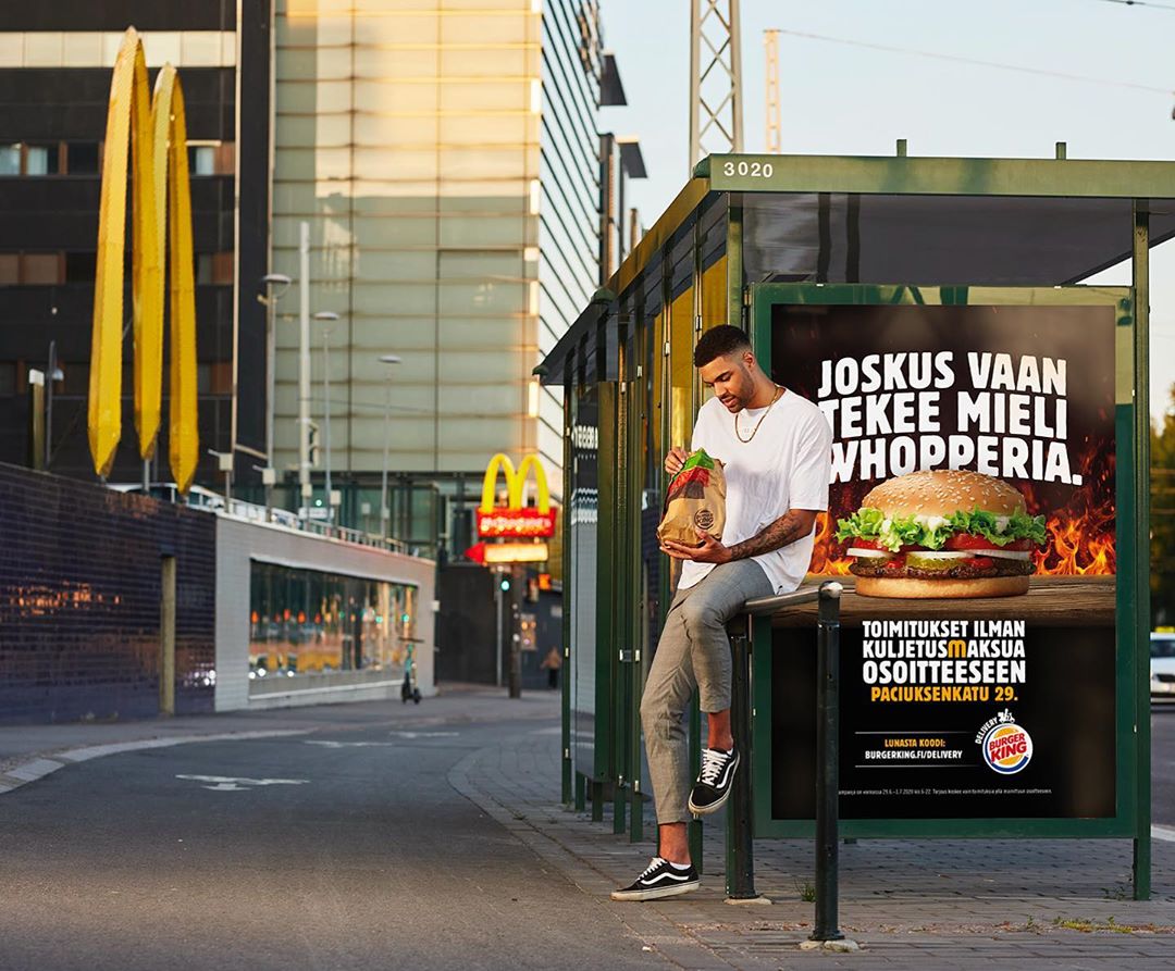 Male content creator posing for Burger King social media campaign with Boksi. 